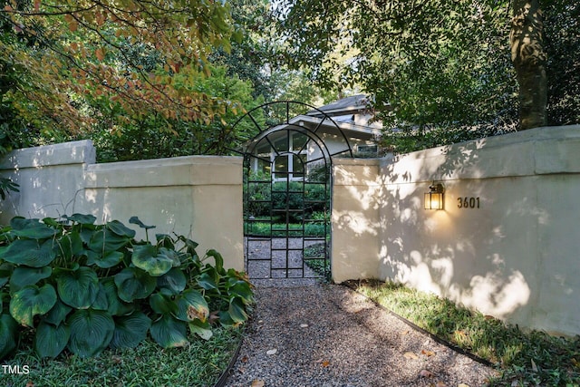 view of gate with fence