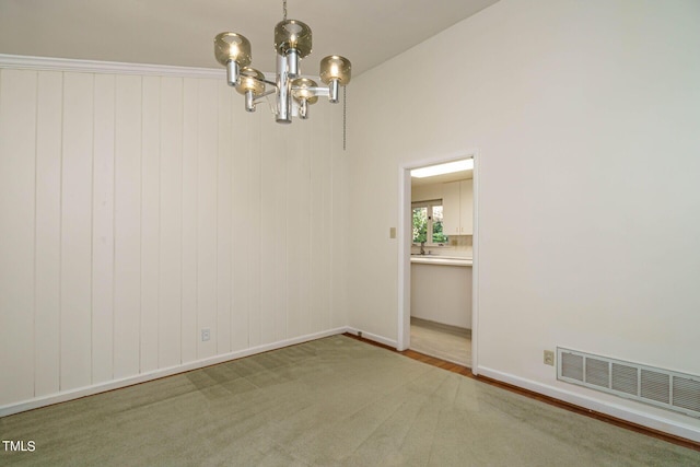 spare room with a notable chandelier and visible vents