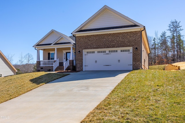 craftsman-style home featuring a porch, concrete driveway, a front yard, a garage, and brick siding