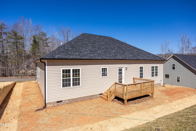 back of house featuring a wooden deck, roof with shingles, and crawl space