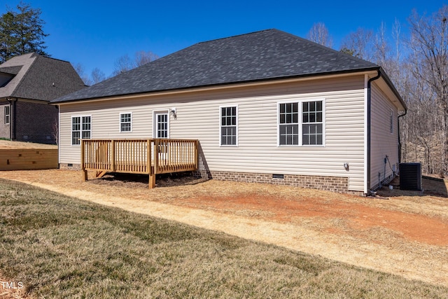 rear view of property with a yard, roof with shingles, a wooden deck, crawl space, and central AC unit