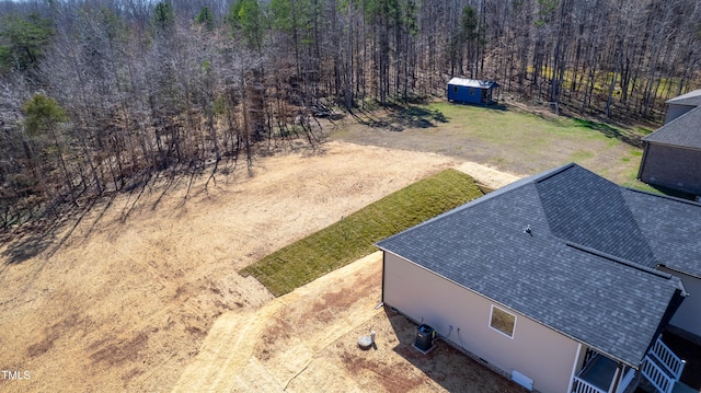 aerial view featuring a view of trees