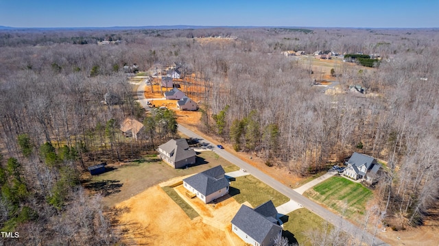 drone / aerial view featuring a rural view and a forest view