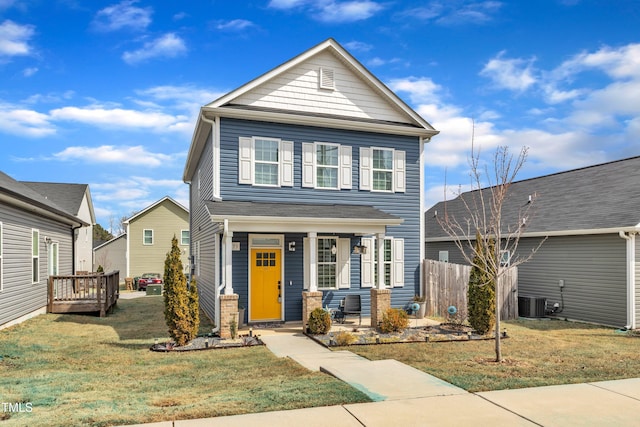 view of front of home with covered porch and a front yard