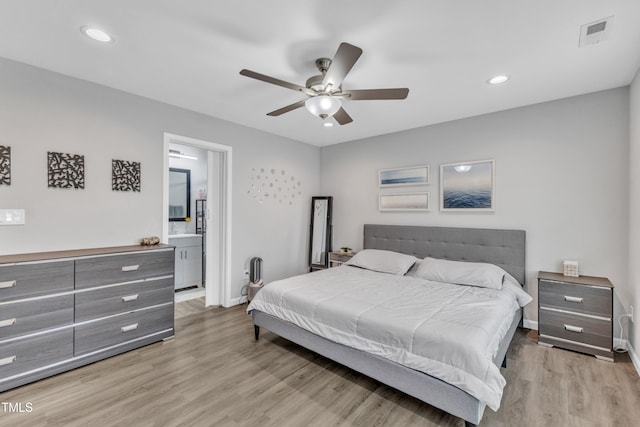 bedroom with recessed lighting, visible vents, baseboards, and wood finished floors