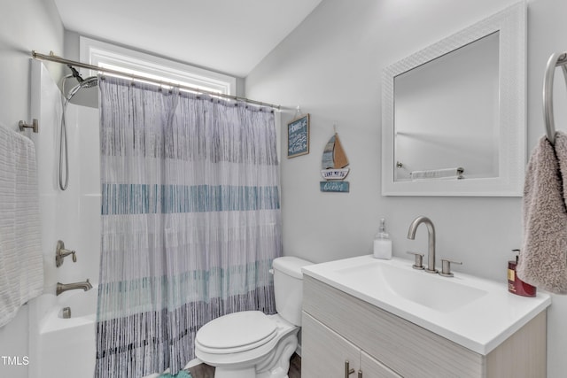 bathroom with vanity, toilet, and shower / bath combo