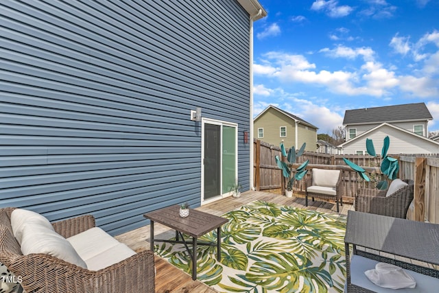 wooden terrace featuring fence