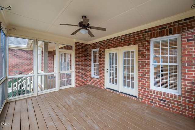 wooden deck with a ceiling fan