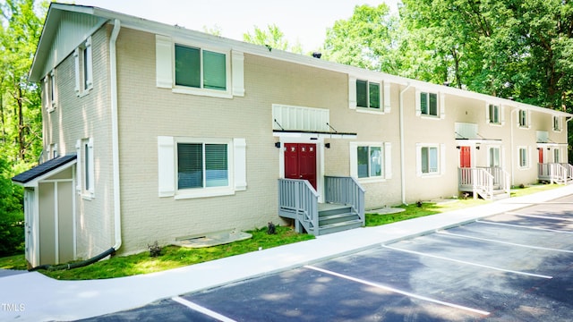 800 Pritchard Avenue Extension Unit H3, Chapel Hill, NC 27516 - view of front of property with brick siding and uncovered parking