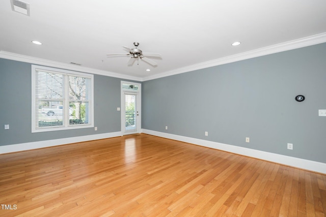 unfurnished room featuring visible vents, ceiling fan, baseboards, light wood-type flooring, and ornamental molding