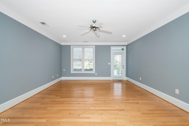 unfurnished room featuring visible vents, ornamental molding, light wood finished floors, baseboards, and ceiling fan