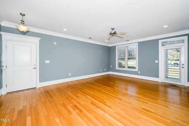 unfurnished living room with light wood-style flooring, baseboards, crown molding, and ceiling fan