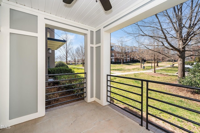 balcony featuring covered porch and a ceiling fan