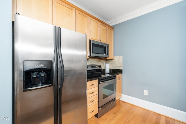 kitchen with light brown cabinets, light wood finished floors, ornamental molding, decorative backsplash, and stainless steel appliances