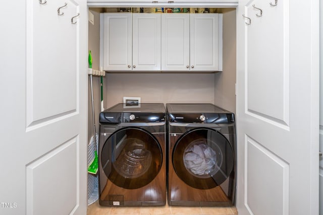 laundry area featuring cabinet space and separate washer and dryer