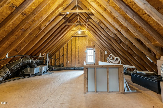 attic featuring an upstairs landing