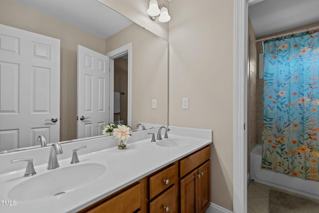 bathroom featuring tile patterned floors, shower / bath combination with curtain, double vanity, and a sink