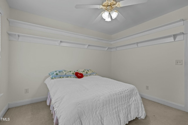 carpeted bedroom with baseboards and ceiling fan