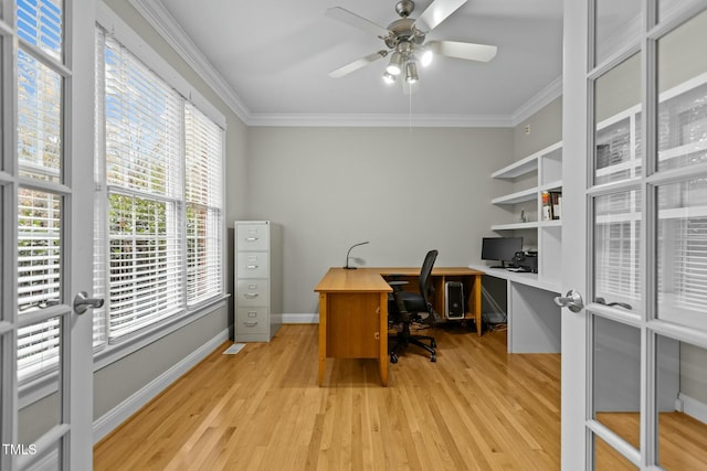 office area with light wood finished floors, baseboards, a ceiling fan, and ornamental molding