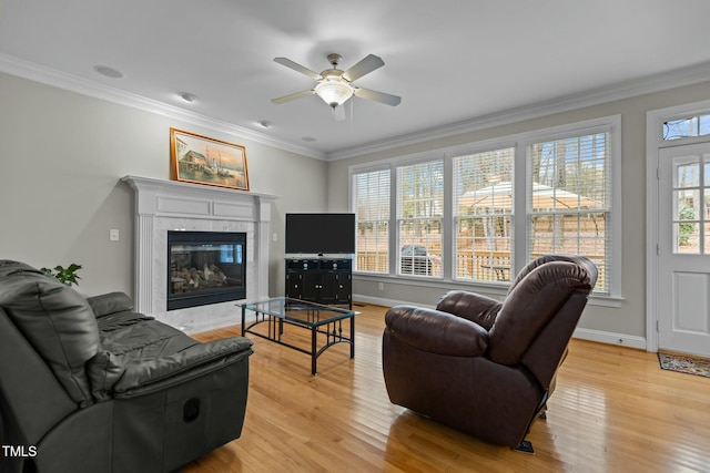 living room featuring crown molding and light wood-style floors