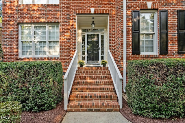 entrance to property with brick siding