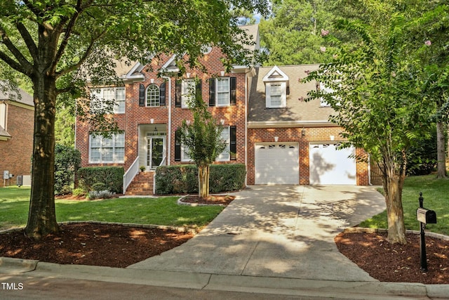 colonial home featuring a front yard, brick siding, an attached garage, and driveway