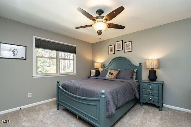 bedroom with baseboards, light carpet, and ceiling fan