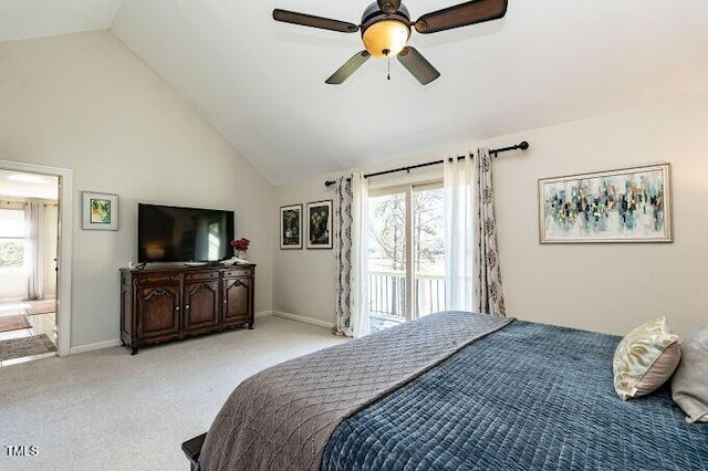 bedroom featuring multiple windows, light carpet, high vaulted ceiling, and access to exterior