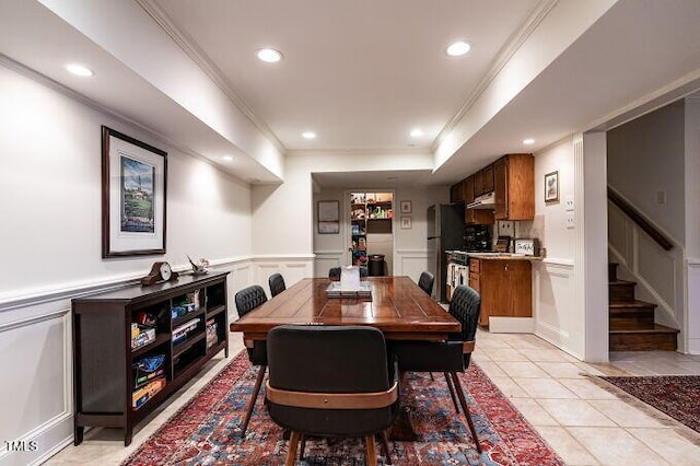 dining space with light tile patterned floors, stairway, a wainscoted wall, and recessed lighting