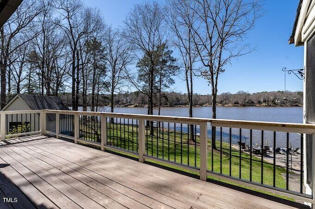 wooden terrace with a water view