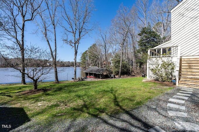 view of yard with stairway and a water view