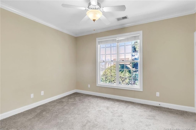 unfurnished room featuring visible vents, carpet, baseboards, and ornamental molding