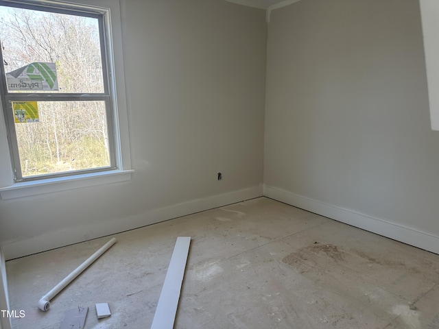 empty room with baseboards