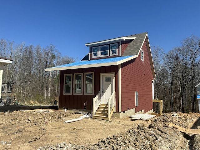 view of front of house featuring crawl space, board and batten siding, and entry steps