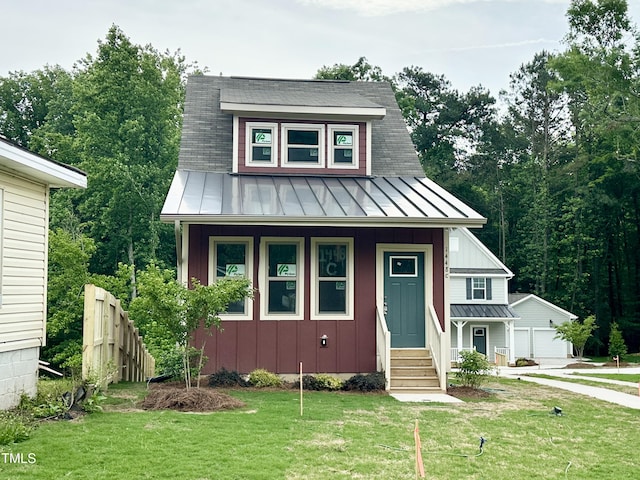 view of front of home with a standing seam roof, board and batten siding, and metal roof