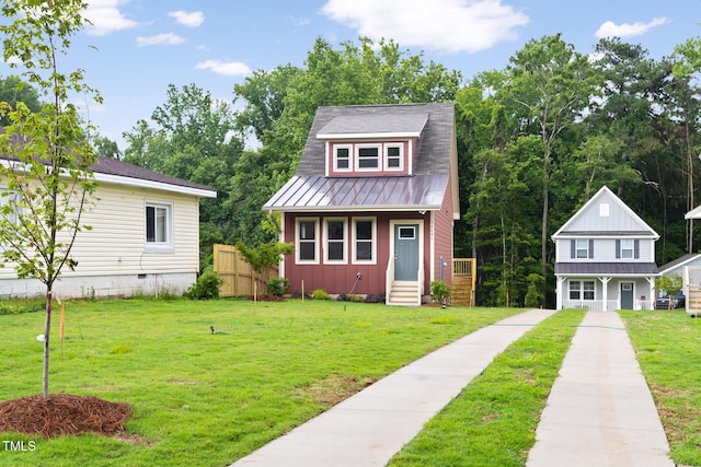 1448C Maplewood Dr, Durham, NC 27704 - view of front of property featuring metal roof, a front lawn, board and batten siding, and a standing seam roof