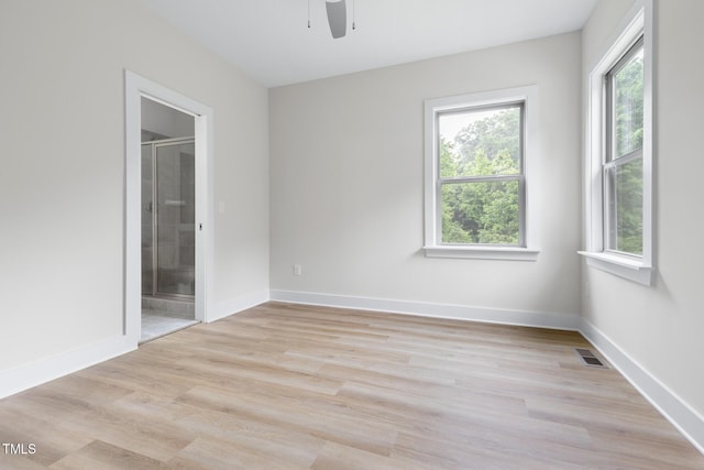 1448C Maplewood Dr, Durham, NC 27704 - empty room featuring a ceiling fan, light wood finished floors, and baseboards