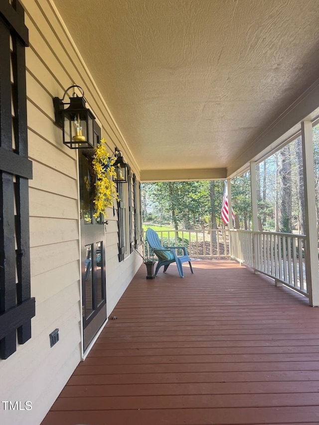 wooden terrace featuring a porch