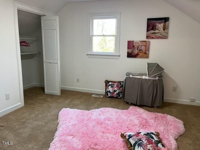 bedroom featuring vaulted ceiling, baseboards, and carpet floors