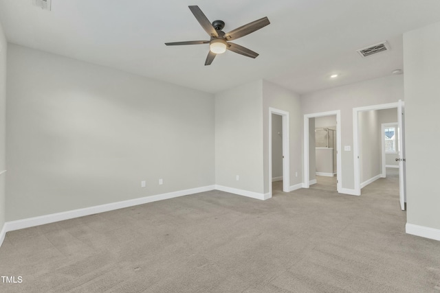 empty room with visible vents, a ceiling fan, recessed lighting, carpet flooring, and baseboards