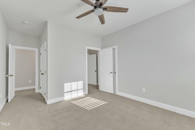 unfurnished bedroom with carpet, baseboards, and ceiling fan