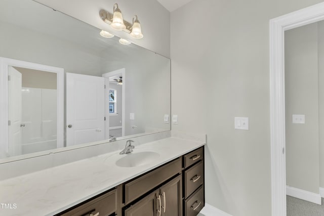 bathroom with vanity and baseboards