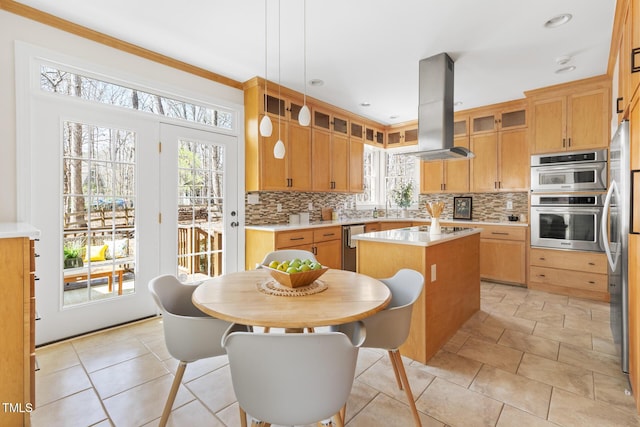 kitchen featuring decorative backsplash, light countertops, a kitchen island, and island range hood