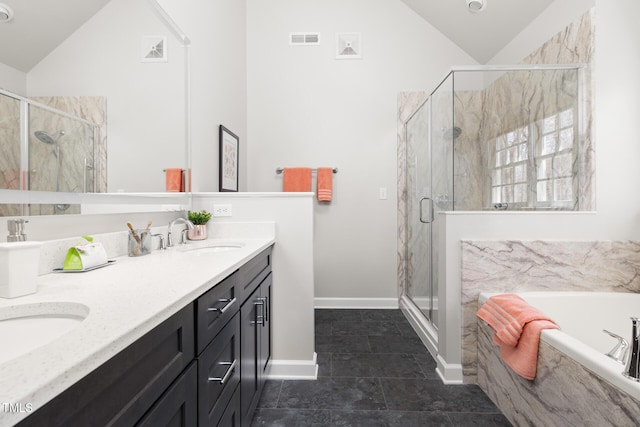 full bath featuring vaulted ceiling, visible vents, a marble finish shower, and a sink