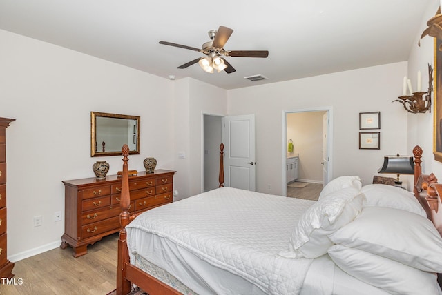 bedroom featuring visible vents, connected bathroom, baseboards, light wood-style flooring, and a ceiling fan