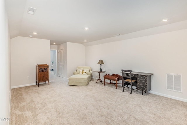 sitting room featuring lofted ceiling, carpet flooring, baseboards, and visible vents