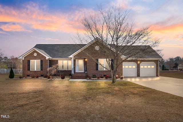 single story home featuring a front yard, driveway, an attached garage, crawl space, and brick siding