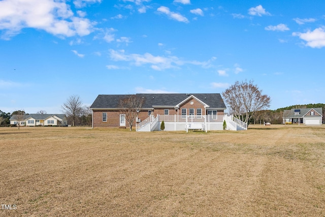 view of front of property with a front lawn and stairway