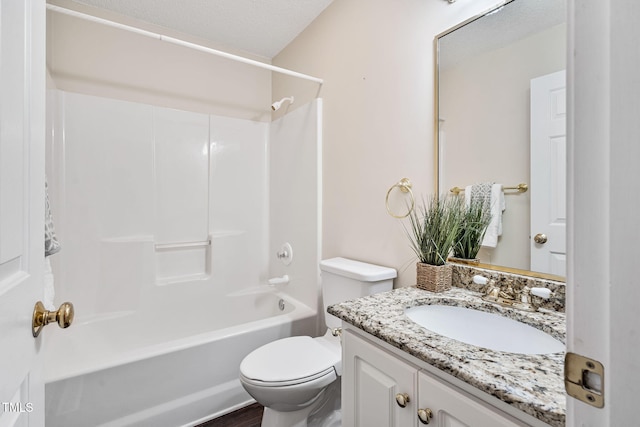 full bath featuring tub / shower combination, a textured ceiling, vanity, and toilet