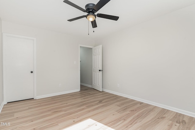 unfurnished bedroom with light wood-style floors, baseboards, and ceiling fan